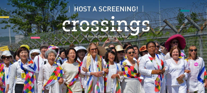 women walking across the korean dmz border for peace